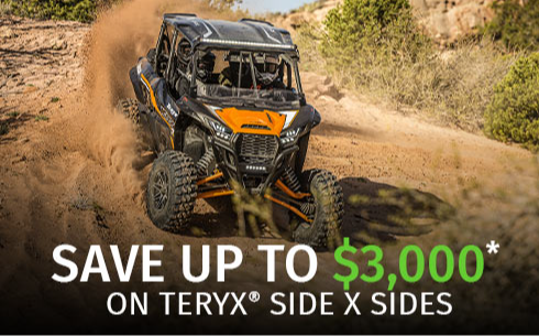 Riders on a dirt trail in a Teryx Side x Side