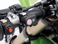 Close up of launch control mode button on motorcycle handlebar