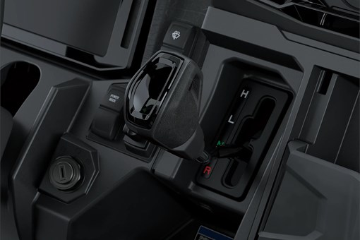 Close-up on a side x side gear shifter. opens in a new window