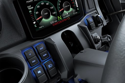 Close-up on a side x side infotainment screen and buttons. opens in a new window