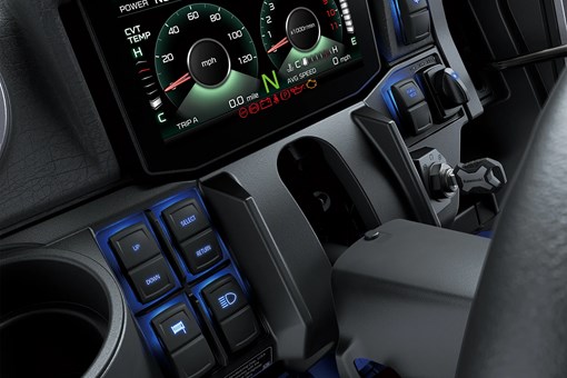 Close-up on a side x side infotainment screen and buttons. opens in a new window
