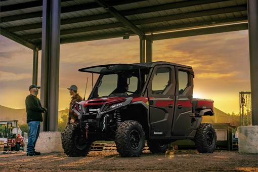 Side x side parked on a ranch at sunset. opens in a new window