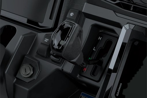 Close-up on a side x side gear shifter. opens in a new window