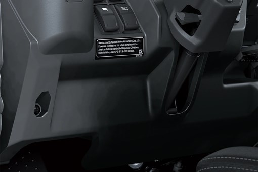 Close-up on steering wheel area in a side x side. opens in a new window
