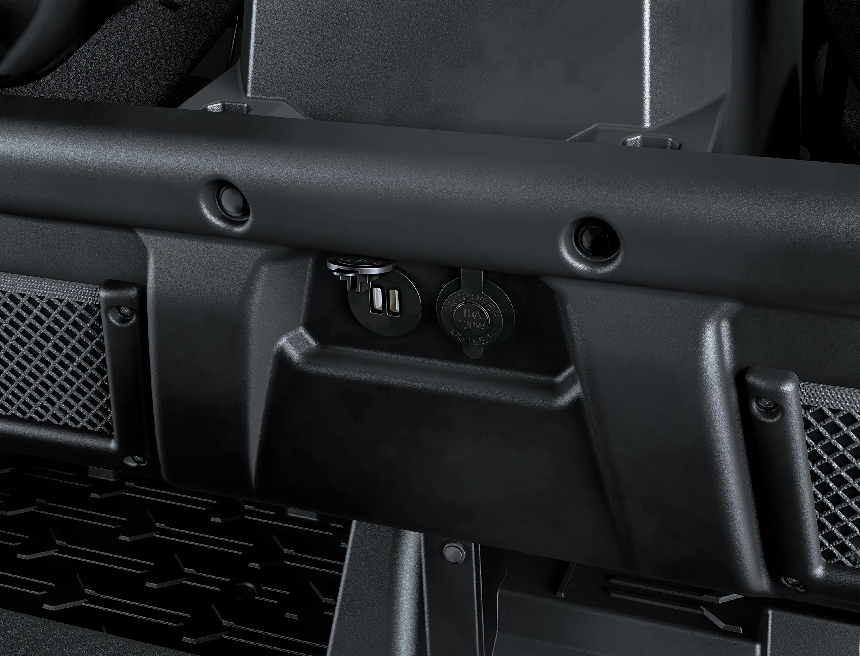 Close-up on a side x side interior charge ports.