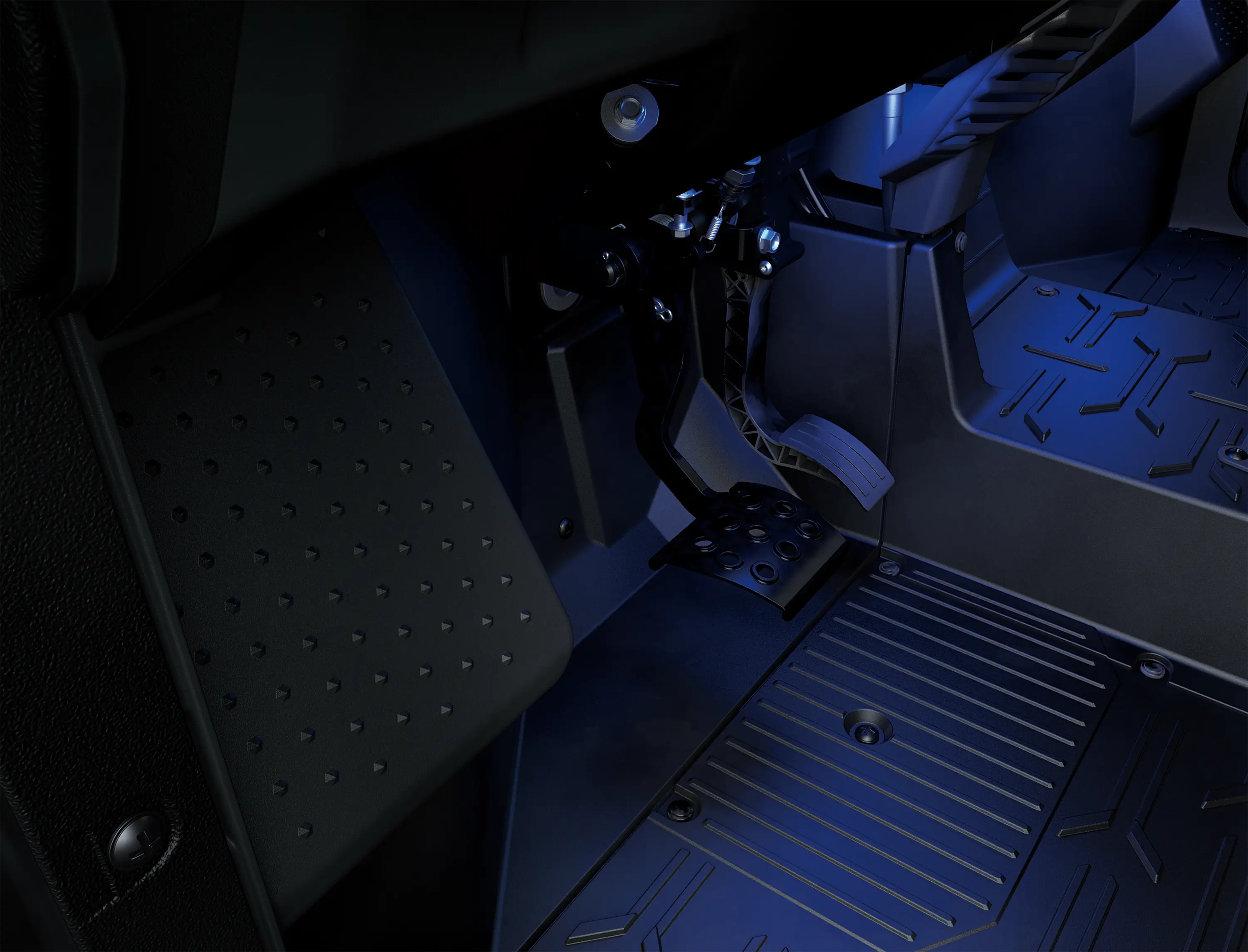 Side x side footwell in blue glow.