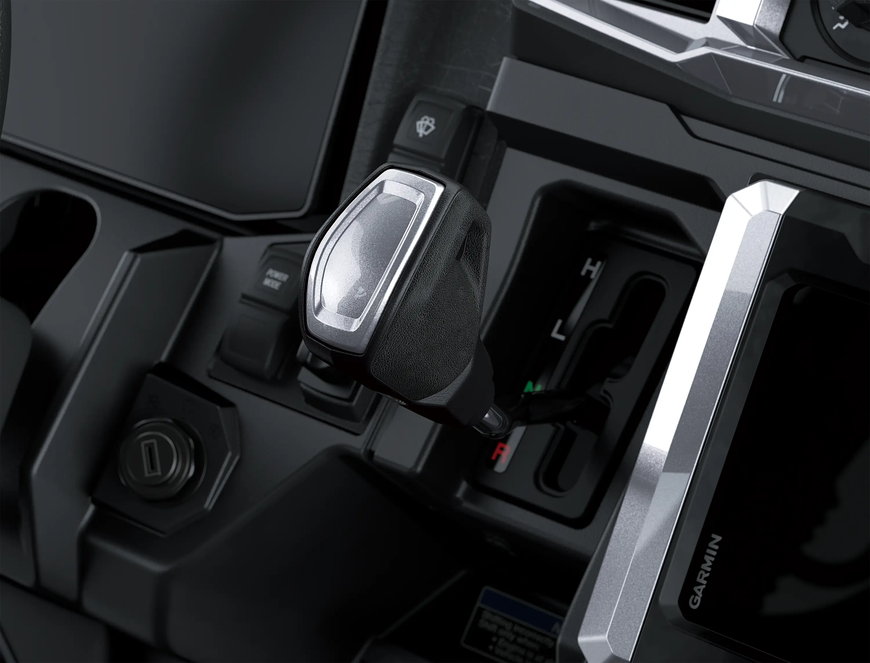 Close-up on a side x side gear shifter.
