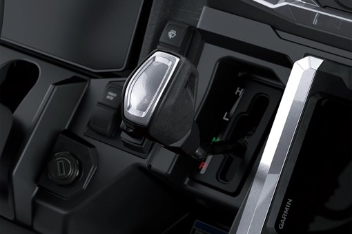 Close-up on a side x side gear shifter. opens in a new window