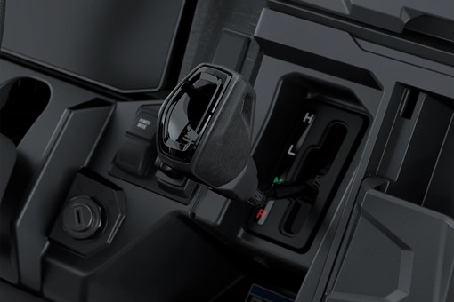 Close-up on a side x side gear shifter. opens in a new window