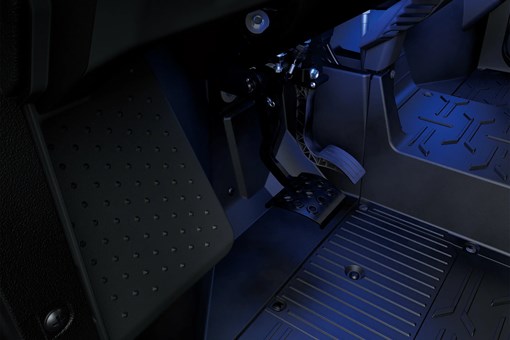 Side x side footwell in blue glow. opens in a new window