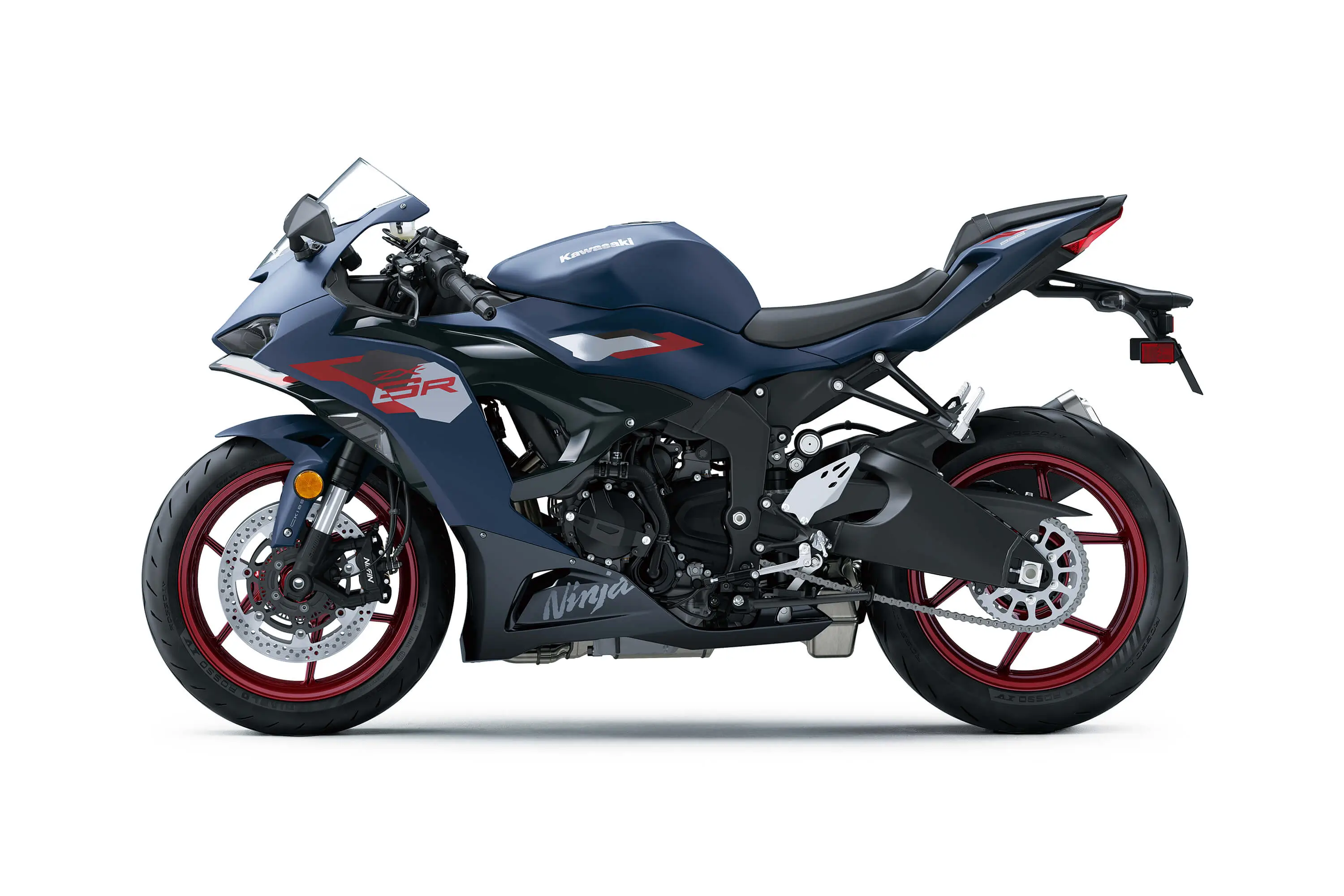 Profile angle of a blue motorcycle staged in a white studio background.