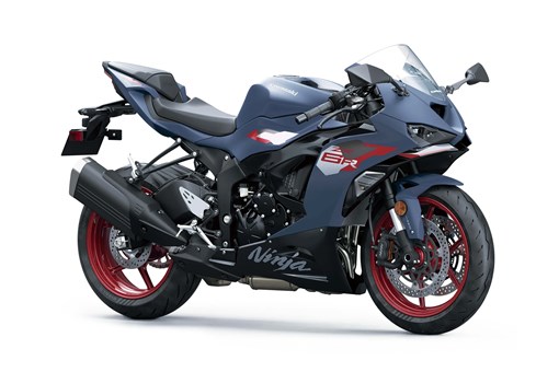 Three-quarter front angle of a blue motorcycle staged in a white studio background. opens in a new window