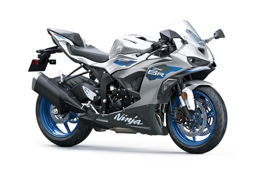 Three-quarter front angle of a silver motorcycle staged in a white studio background. opens in a new window