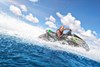 Profile angle of person riding a personal watercraft on water.