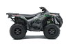 Side angle of a green and red accent ATV with a white studio background.