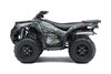 Profile angle of a green and red accent ATV with a white studio background.