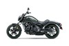 Profile angle of a dark grey Motorcycle with a white studio background. 
