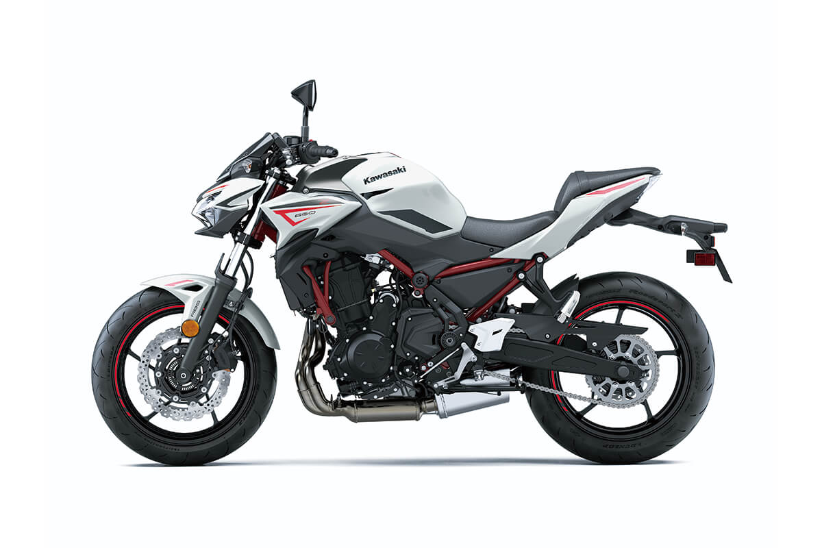 Profile angle of a motorcycle in front of a white studio background.