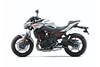 Profile angle of a motorcycle in front of a white studio background.