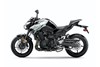 Profile angle of a motorcycle staged in a white studio background.