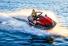 Woman turning a Jet Ski on the water.