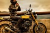 Close-up profile angle of rider sitting on a motorcycle.