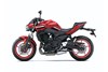 Profile angle of a motorcycle in front of a white studio background.
