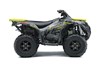 Profile angle of an ATV with yellow accents staged in a white studio background.