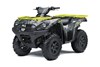Three-quarter front angle of an ATV with yellow accents staged in a white studio background.