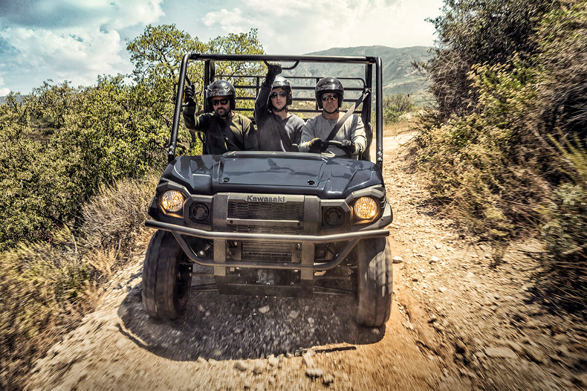Front angle of a person driving a side x side off-road.