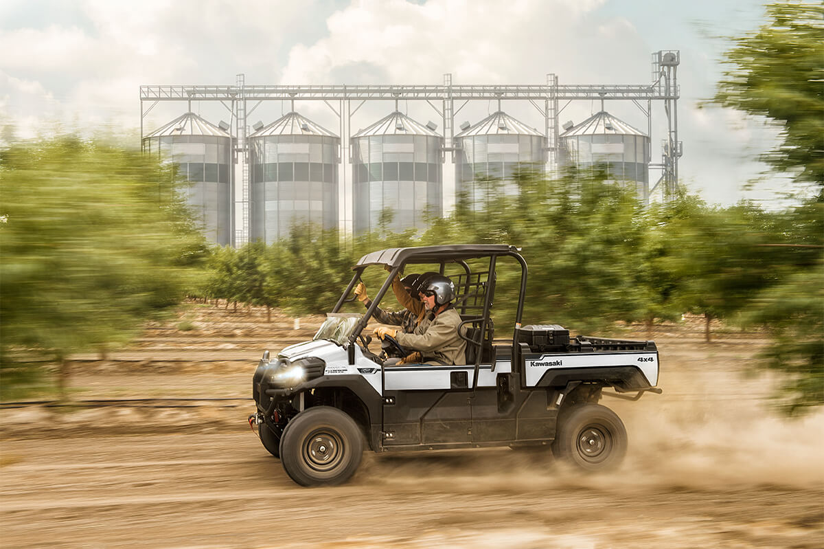 Side angle of a person driving a side x side off-road.