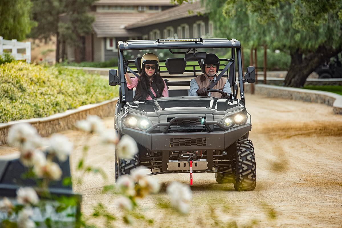Front angle of a person driving a side x side off-road.