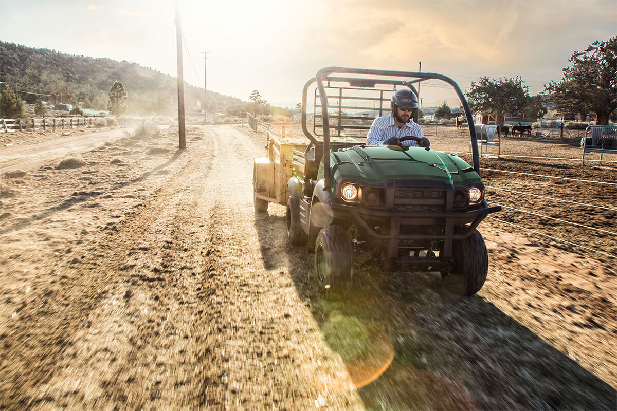Front angle of a person driving a side x side off-road.