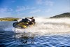 Side angle of a person turning on a personal watercraft on the water.
