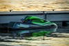 Side angle of a personal watercraft on the water.