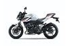 Profile angle of a white motorcycle staged in a white studio background.