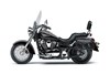 Profile angle of a motorcycle staged in a white studio background.