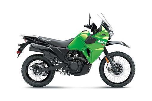Side angle of a green motorcycle staged in a white studio background. opens in a new window