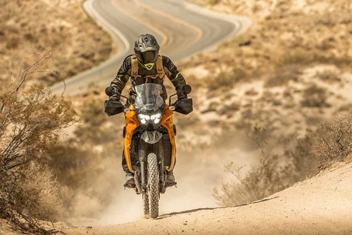 Front angle of a person riding a motorcycle off-road. opens in a new window