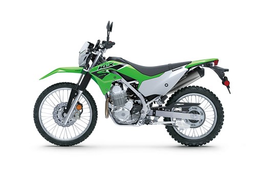 Side angle of a green motorcycle staged in a white studio background. opens in a new window