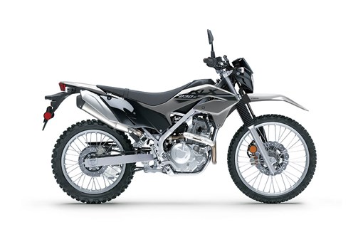 Profile angle of a grey and black motorcycle staged in a white studio background. opens in a new window