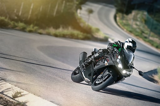 Three-quarter front angle of a person turning on a highway. opens in a new window