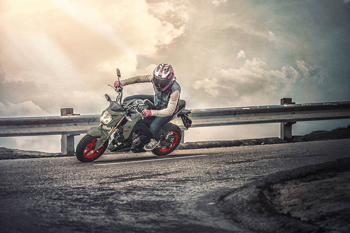 Three-quarter front angle of a person making a sharp turn on a highway.