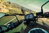 Rider's point of view while riding a motorcycle on a highway.