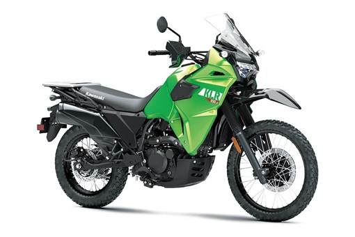 Three-quarter front angle of a lime green motorcycle staged in a white studio background. opens in a new window