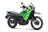 Three-quarter front angle of a lime green motorcycle staged in a white studio background.