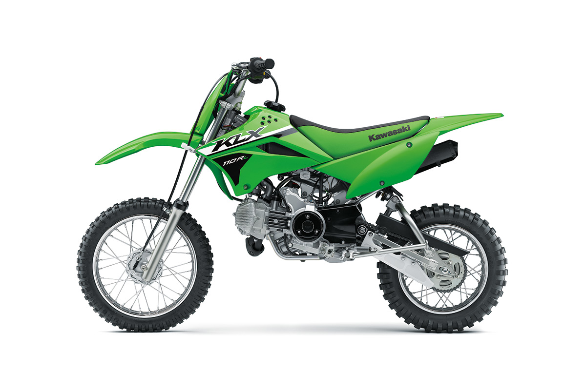 Side angle of a green motorcycle staged in a white studio background.
