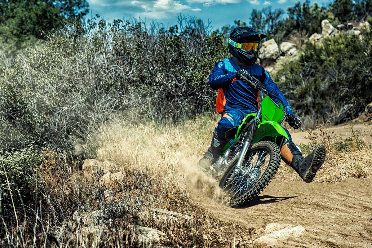 Front angle of a person riding a motorcycle off-road.