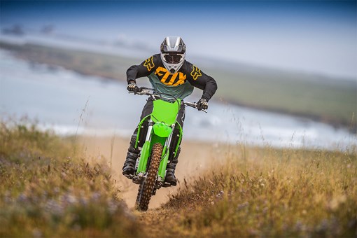 Front angle of a person riding a motorcycle off-road. opens in a new window