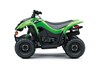 Profile angle of a green ATV staged in a white studio background.